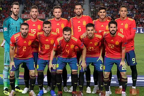 Spain players pose for a team group photo before the match