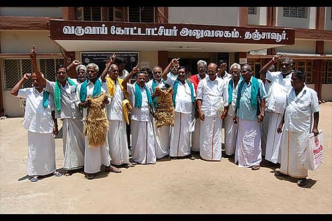 Farmers stage a protest with withered nurseries at the RDO office in Thanjavur on Tuesday