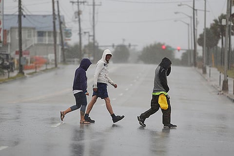 People push through the heavy rains and wind during Hurricane Florence , South Carolina