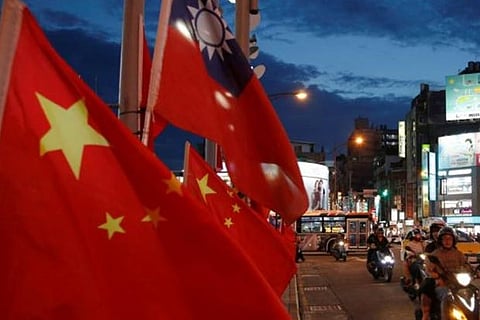Chinese national flags and the Republic of China (Taiwan) flags are seen in Taipei