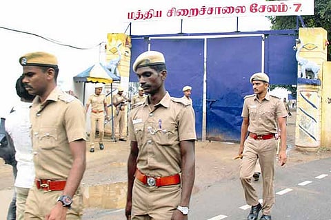 Police personnel return after the raid at the Salem Central Prison on Sunday