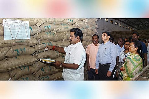 Minister R Kamaraj inspects rice bags at the government warehouse in Chennai on Wednesdsay