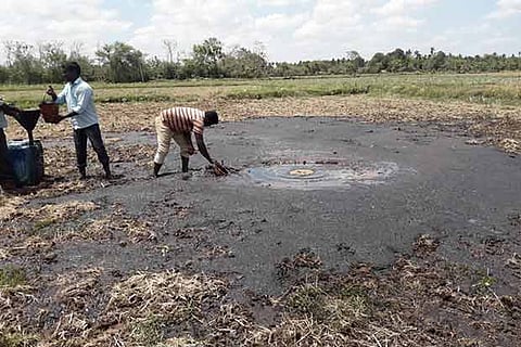 The crude oil sludge on the farm land