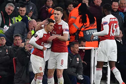 Lucas Torreira (left) is congratulated by Aaron Ramsey after the second Arsenal goal