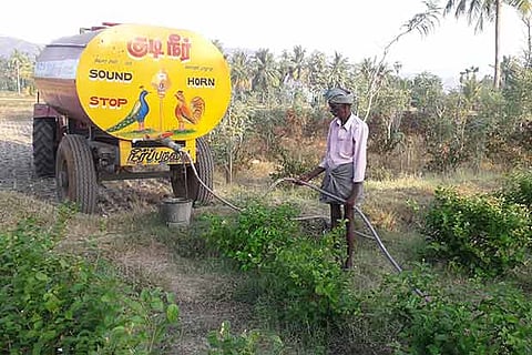 A farmer in Kannamangalam, who had to purchase water and hire a tractor, to irrigate his field