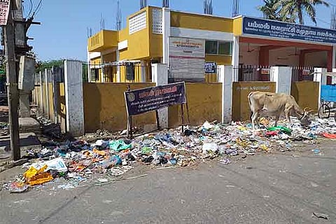 Garbage strewn around the municipal Community Hall in Pammal despite a board warning against the dumping