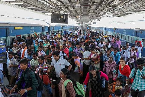 Passengers at Egmore railway station on Wednesday heading home to exercise their franchise