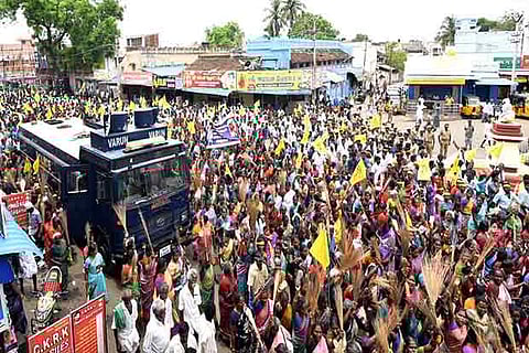 People protesting against the derogatory remarks spread on social media against the women of a group