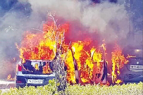 Smoke billowing out of the cars that were parked on GN Chetty Road in T Nagar on Monday