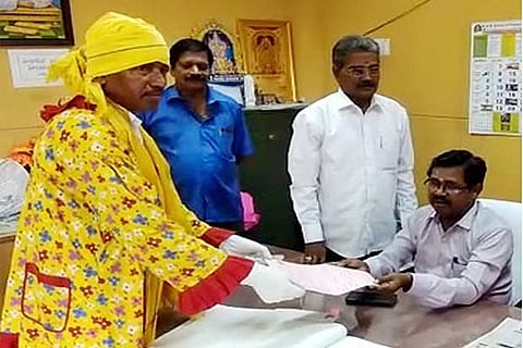 Independent candidate Noor Muhammed filing his nomination in clown attire for Sulur bypoll on Monday