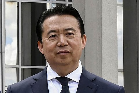China formally arrests Interpol's former chief for corruption