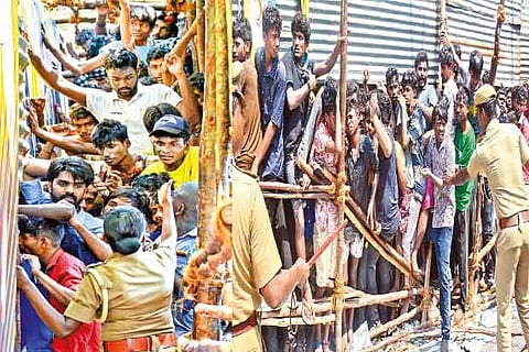Police try to manage the cricket fans at MA Chidambaram stadium on Wednesday