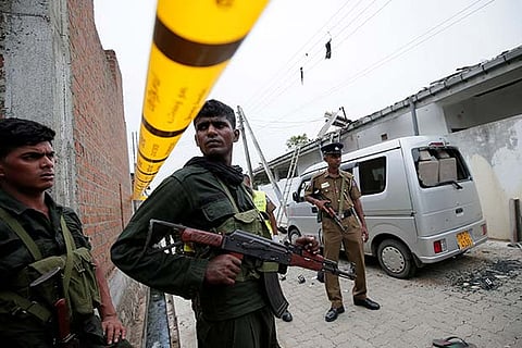 Sri Lankan security at the site of an overnight gun battle against suspected Islamist militants
