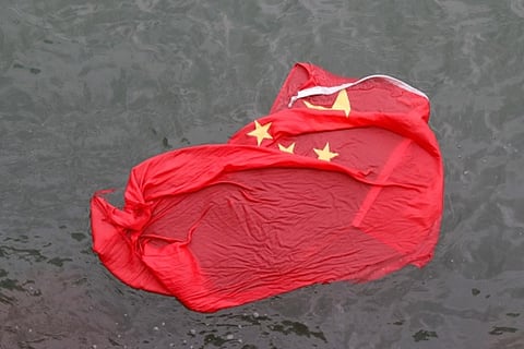 Hong Kong protesters throw Chinese flag into iconic harbour