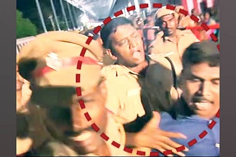 Screen grab of SP pushing the journalist