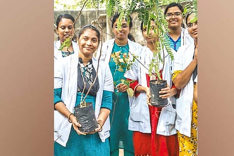 Doctors with the saplings they planted on Thursday