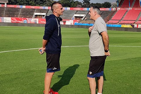 Club captain Lucian Goian (left) and gaffer Owen Coyle in a chat