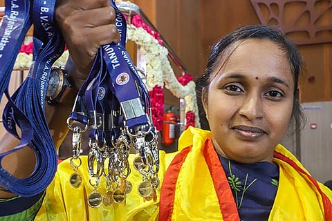 Anandi with her medals during the ceremony