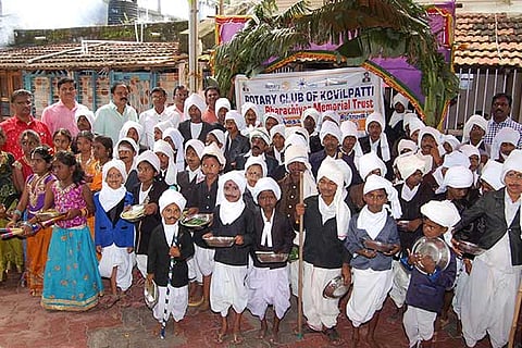 Students dressed up as poet Bharathi pose at Ettayapuram on the occasion of the poet?s 137th birth anniversary