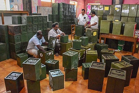 Personnel checking ballot boxes in a strong room in Chennai on Thursday