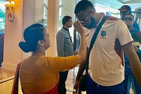 West Indies captain Kieron Pollard is given a traditional welcome on his arrival in Chennai on Thursday