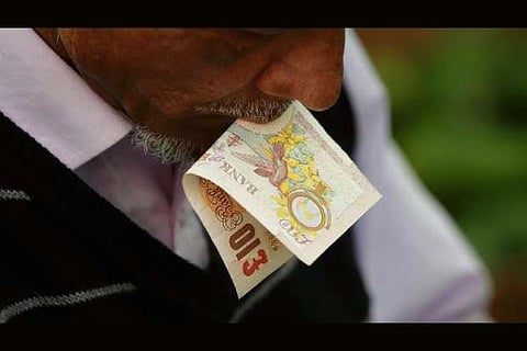 Pound jumps as exit poll shows Conservative majority in British vote