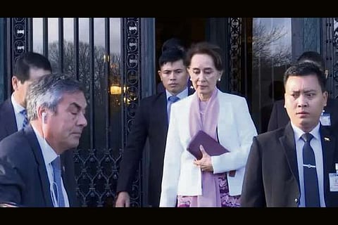 Myanmar's leader Aung San Suu Kyi leaves the International Court of Justice