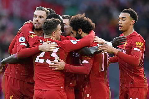 Liverpool players celebrate Mohamed Salah?s goal against Watford in the Premier League