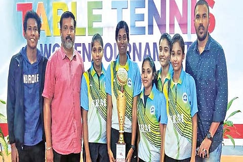 The triumphant SRM women?s table tennis team with the winner?s trophy