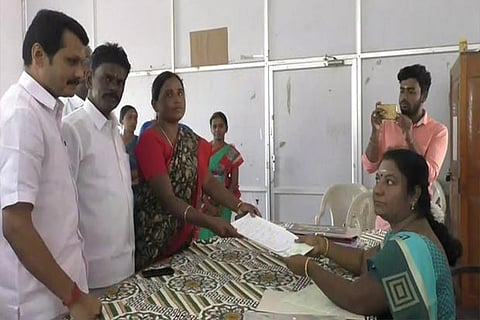 A candidate filing nominations to the returning officer in Karur on Monday