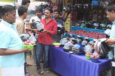 Customers buying helmets at the Salem shop, which announced the novel offer