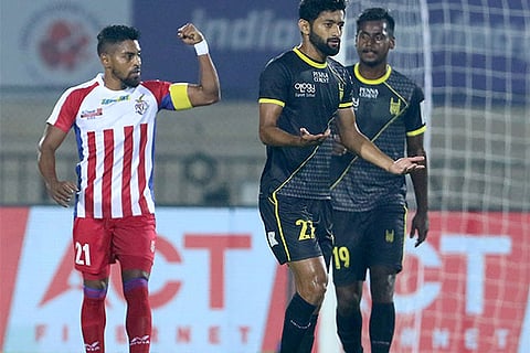 Striker Roy Krishna (left) netted in the 90th minute