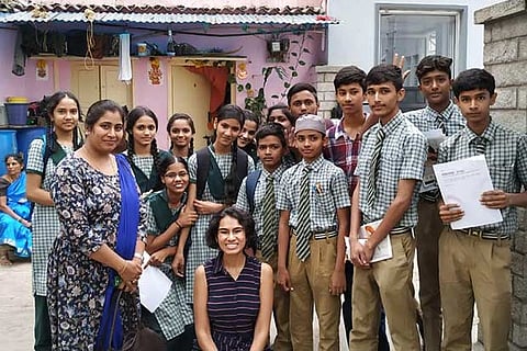 Volunteers from KidsWhoKode with school students