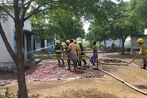 Firefighters dousing the flames at the cracker manufacturing unit in Virudhunagar district, on Saturday
