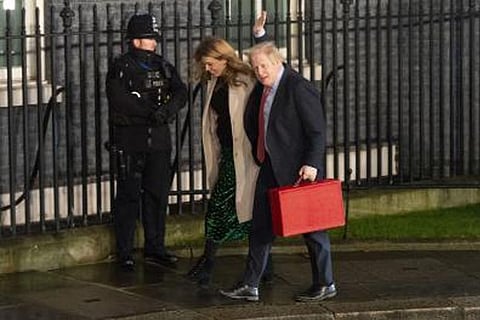 Johnson, girlfriend fly economy to the Caribbean