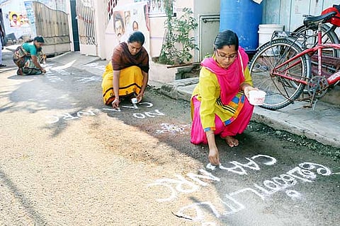 Women draw anti-CAA kolams in front of their houses in Salem on Monday