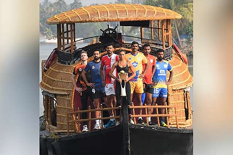 Captains of the six participating teams pose with the Pro Volleyball League (PVL) trophy in Kochi