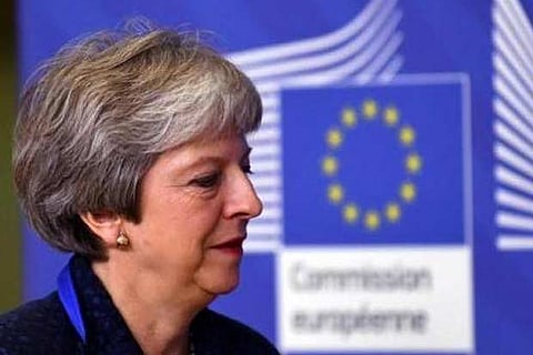 Three MPs quit UK PM May's party over Brexit