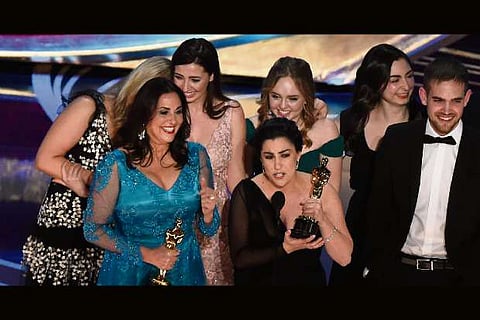 The cast of '"Period - End of Sentence"accepts academy award at Oscars 2019