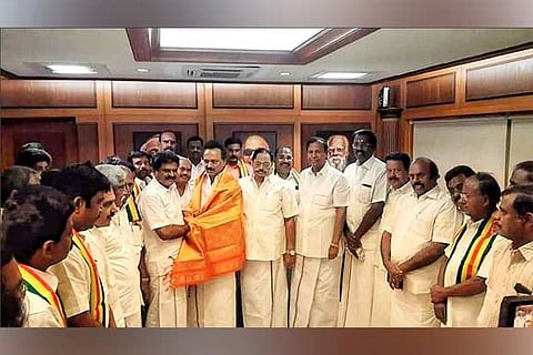 KNMDK leader ER Eswaran felicitates DMK president MK Stalin at Anna Arivalayam on Tuesday