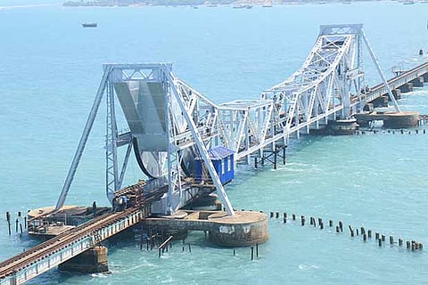 Railway engineers oversee the repair works at the cantilever Pamban bridge near Rameswaram on Tuesday
