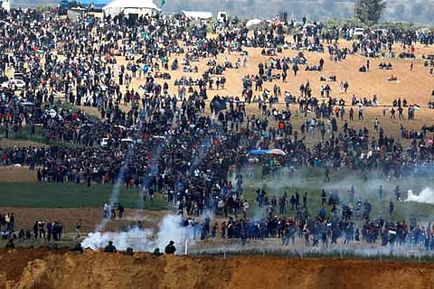 Palestinians protest on the Gaza side of the border in March 2018