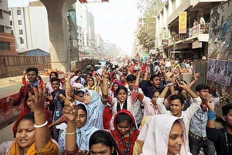 Baton-wielding Bangladesh police fire tear gas to break up garment pay clashes