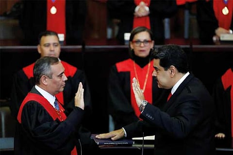 Venezuela's President Nicolas Maduro is sworn in by Venezuela's Supreme Court President Maikel Moren