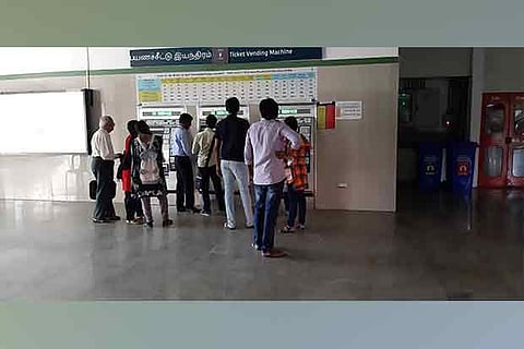 A staffer steps in to help the commuters after many complaints at Vadapalani metro station on Friday