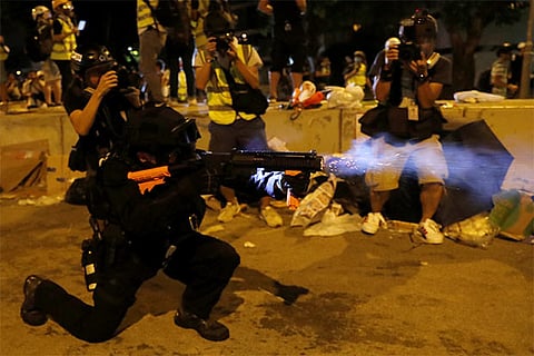 Hong Kong police fire tear gas to disperse anti-government protesters