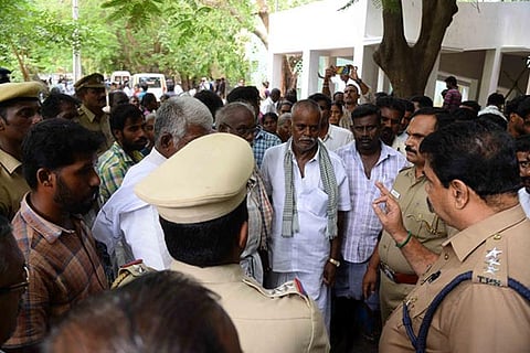 Police hold talks with the protesters at Erode GH on Wednesday