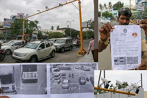 An officer holds up a copy of an e-challan which carries photos of the vehicle while it was caught breaking