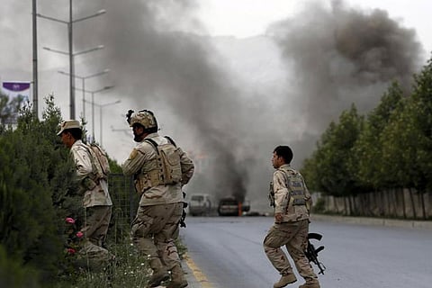 Afghan official: Taliban mortars hit busy market, kill 14