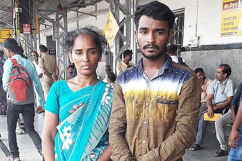 Mariammal with her son Manidurai at Tirupur railway junction on Tuesday